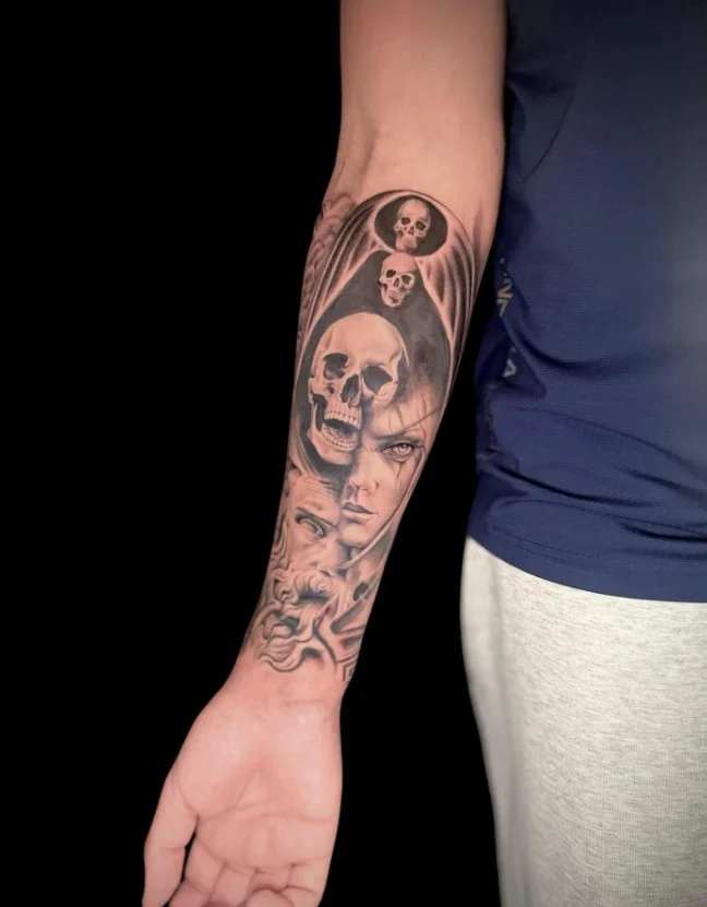 Upper forearm tattoo women black-and-grey portrait tattoo