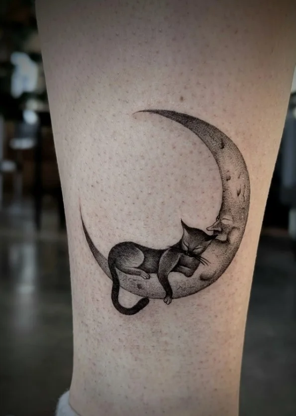 Black cat and crescent moon calf tattoo for women