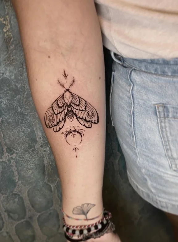 Upper forearm tattoo women blackwork moth tattoo