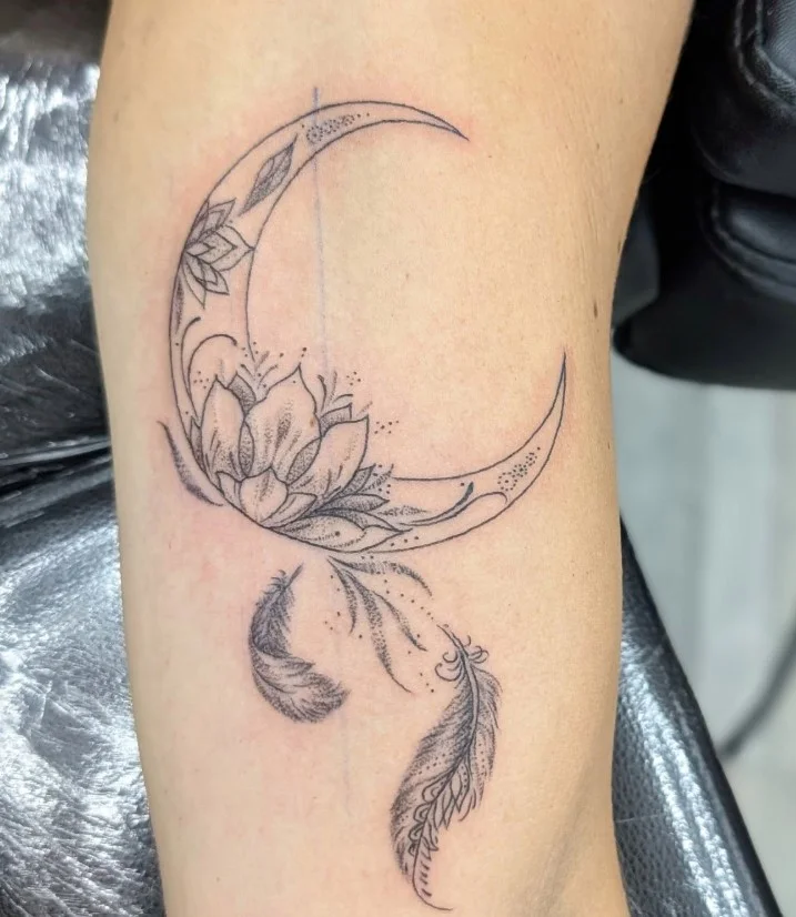 Upper forearm tattoo women crescent moon botanical branch tattoo