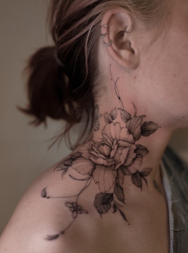 Fine-line floral neck tattoo with elegant flowers and botanical details