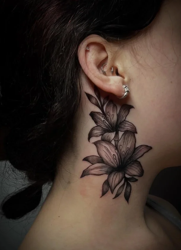 Floral vine side neck tattoo flowing vertically with leaves and flowers