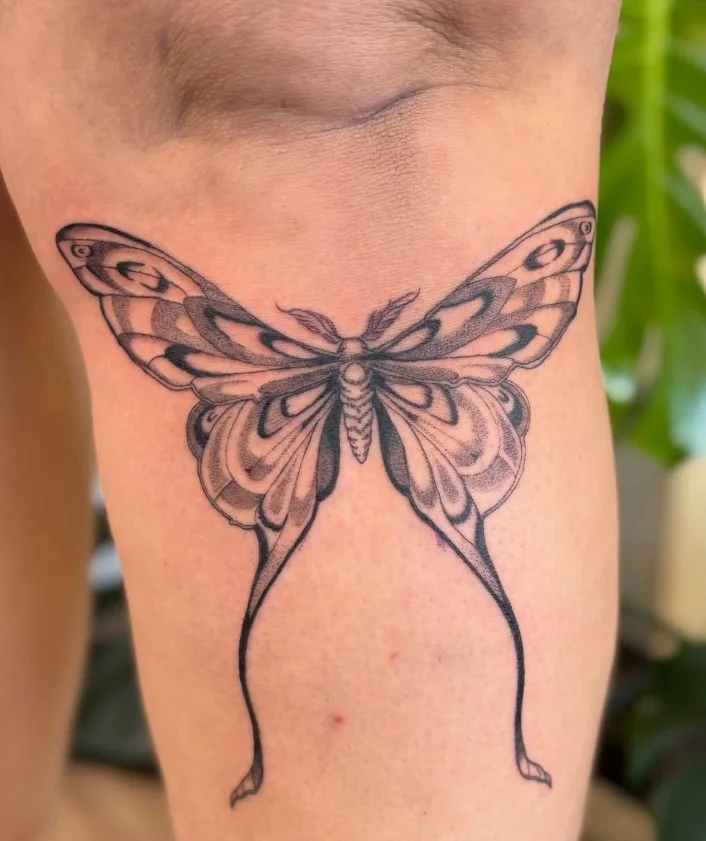 Luna moth lower leg tattoo for women with detailed wings