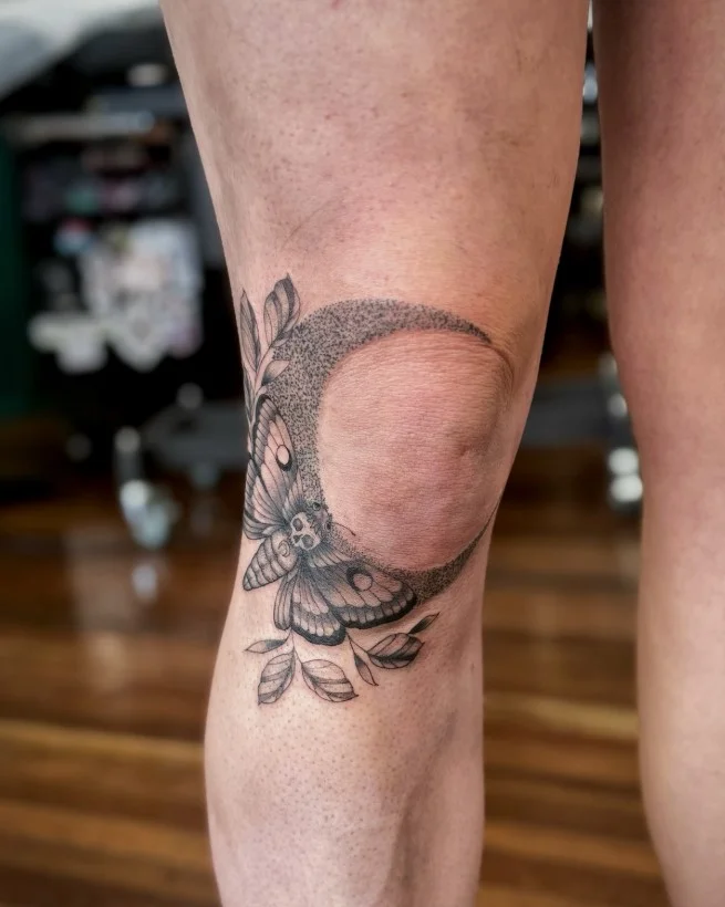 Moth and crescent moon lower leg tattoo for women