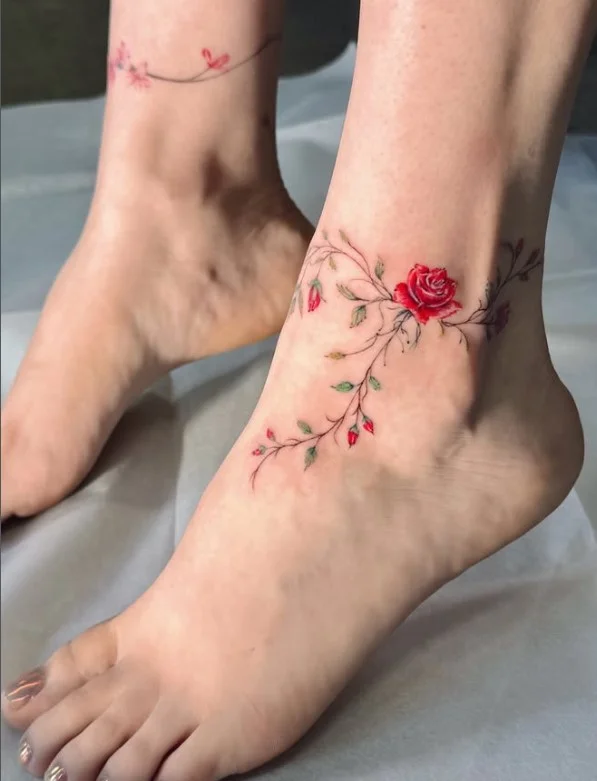 Personal fine line symbol ankle tattoo featuring a small meaningful minimalist symbol in a delicate ankle placement