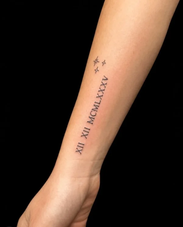 Upper forearm tattoo women Roman numeral date tattoo