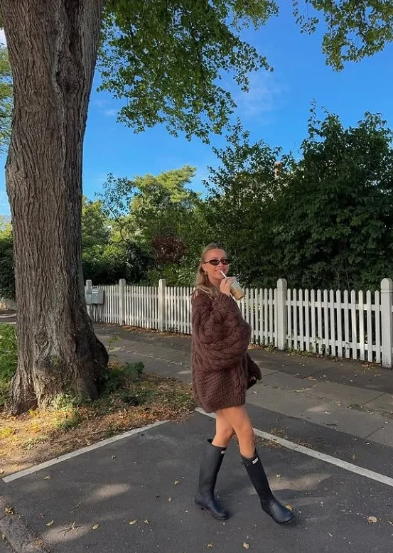 Sweater dress with tall Hunter boots for winter