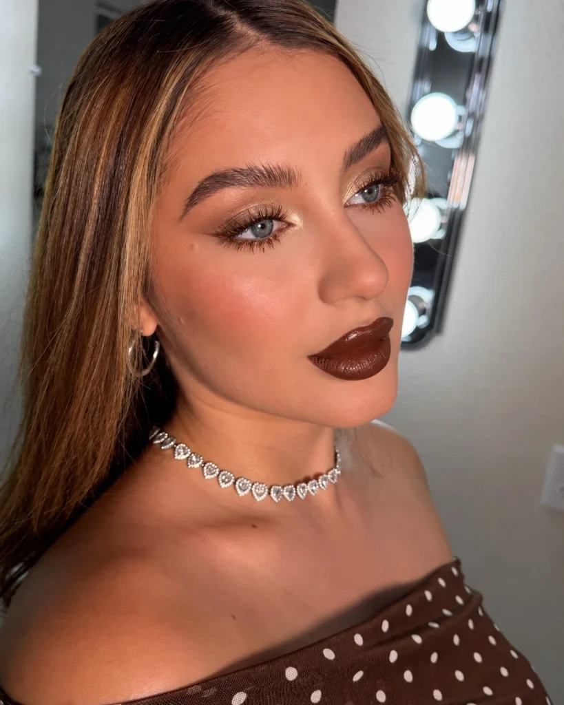 Woman with blue eyes wearing bronze mascara for a warm, softly defined eye look