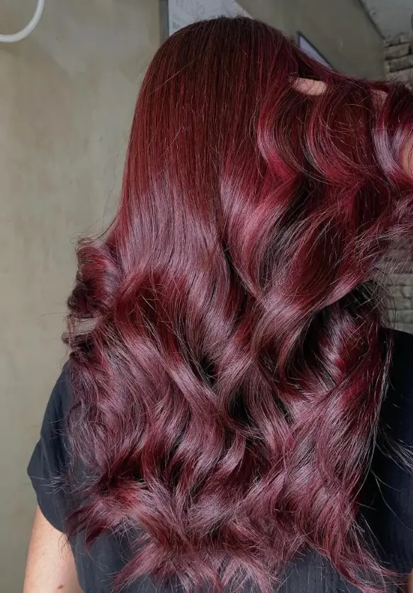 Cherry mahogany brown hair with warm red tones and deep brunette color
