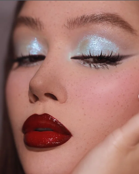 Cherry red lipstick in a bright, vibrant red shade for a bold lip look.