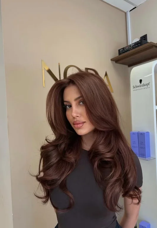 Cinnamon brown hair color for light olive skin with warm brown tones and subtle reddish highlights.