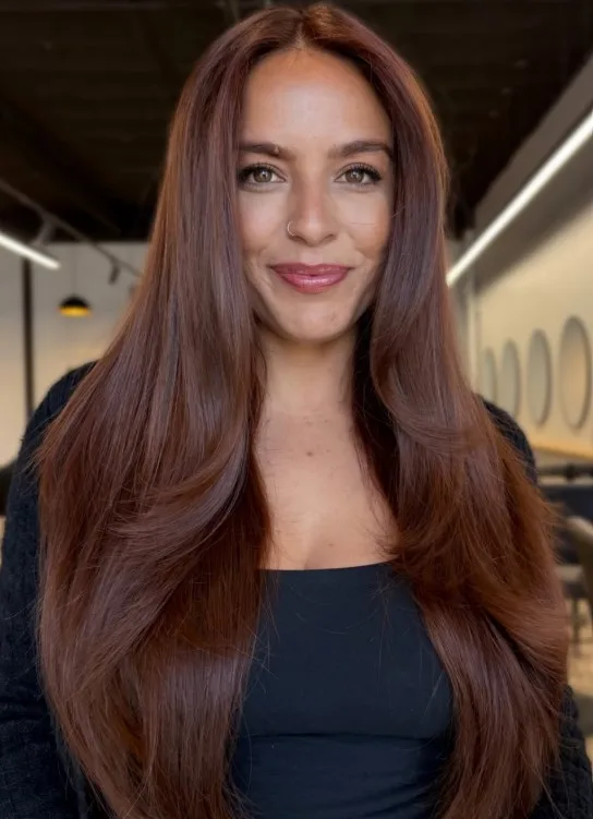 Cinnamon red-brown hair with warm copper tones and natural-looking dimension.