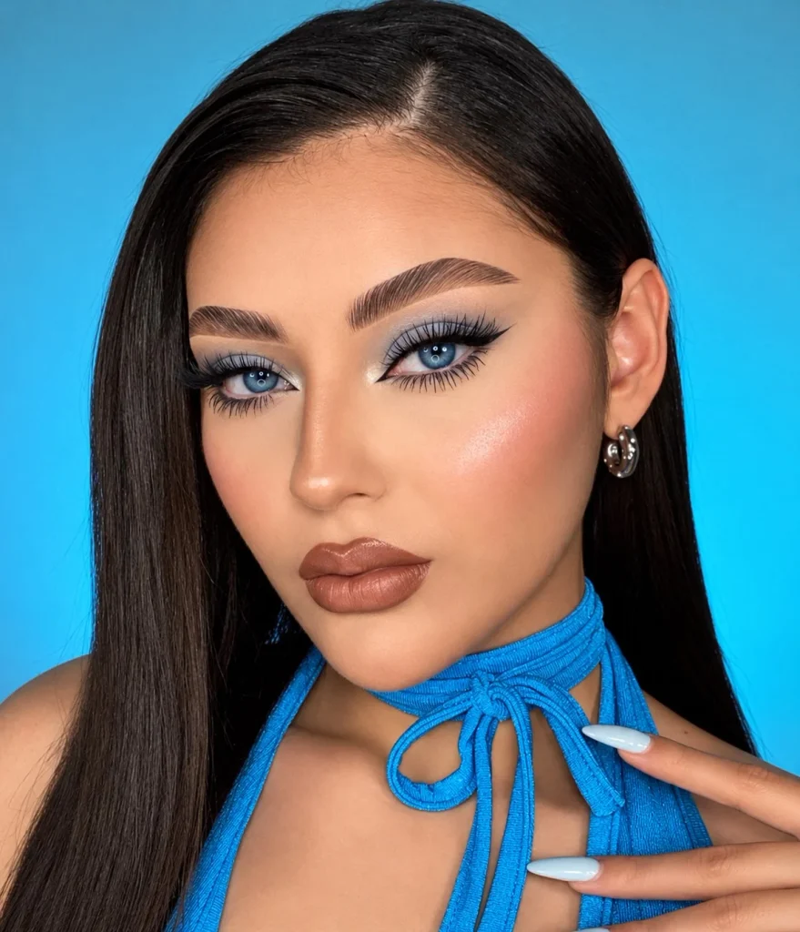 Woman with blue eyes wearing classic black mascara for defined, fuller-looking lashes