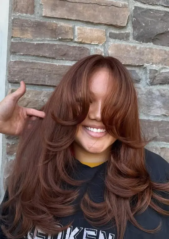Copper auburn hair with rich reddish-brown and copper tones.