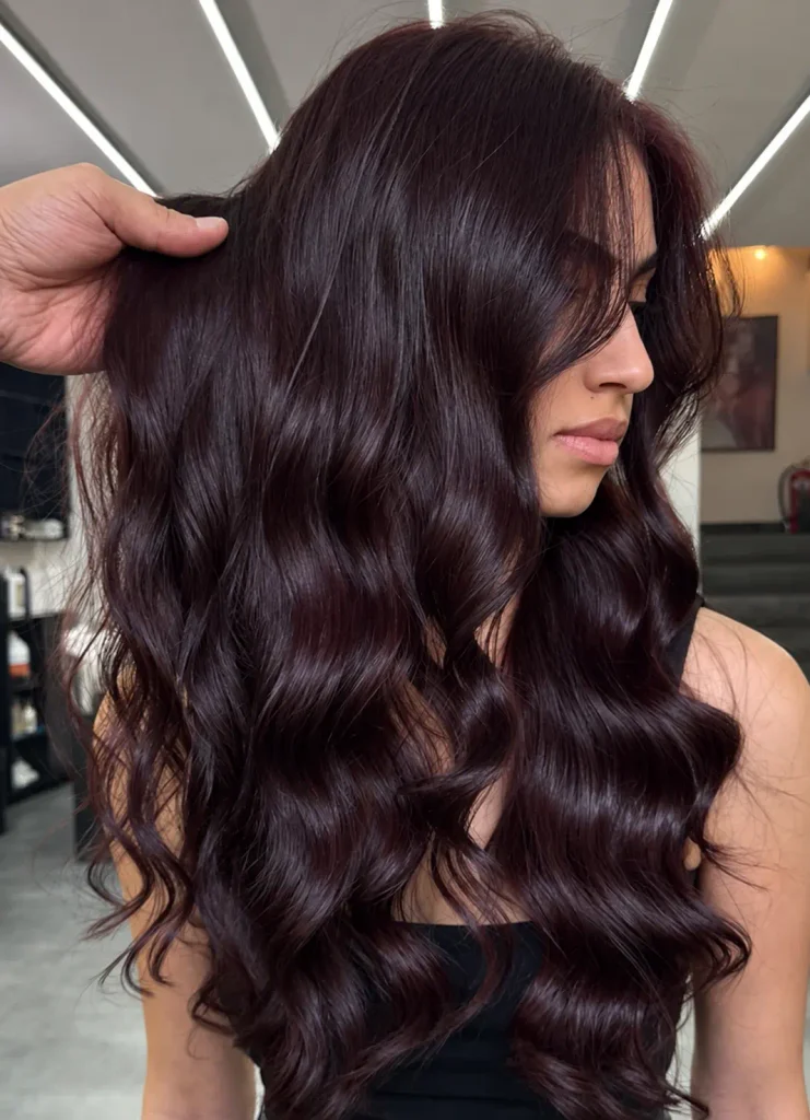Deep cherry brown hair blended from darker roots into red-brown lengths