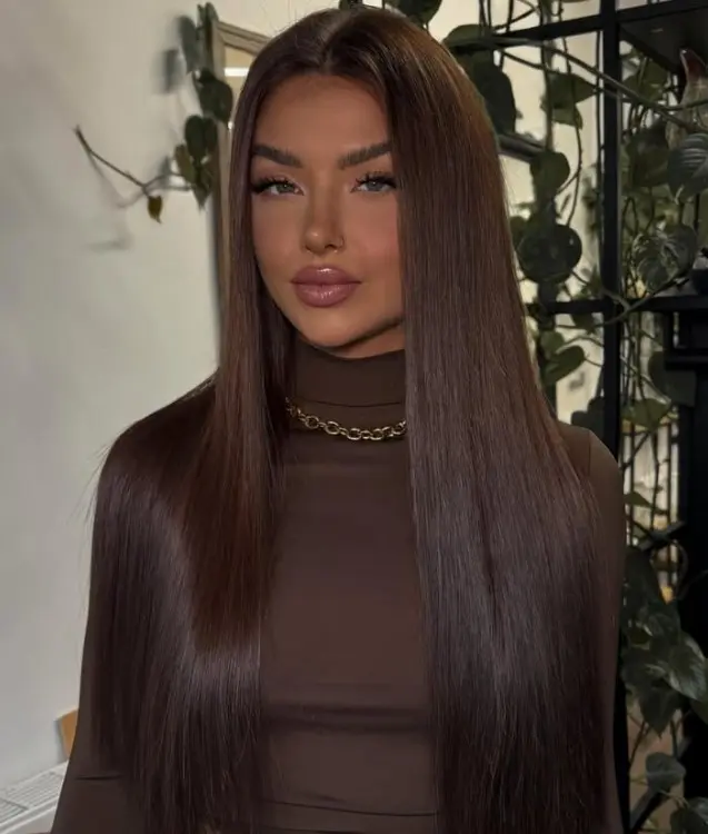  Sleek deep espresso brown hair with a smooth, glossy finish.