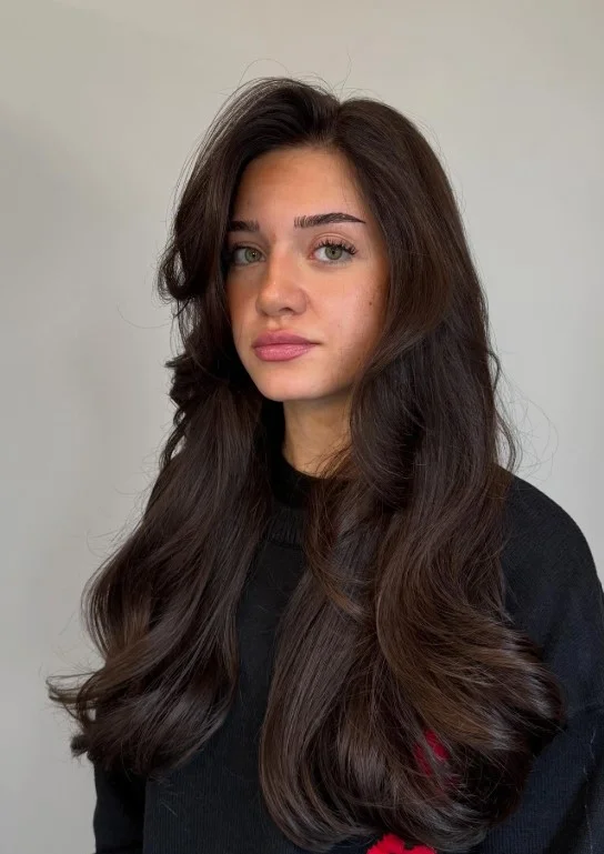 Deep espresso brown hair color for light olive skin with a sleek, glossy, almost-black brunette finish.