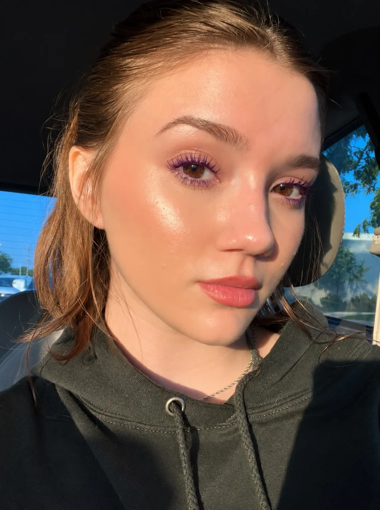 Woman with brown eyes wearing deep violet mascara with softly defined eye makeup