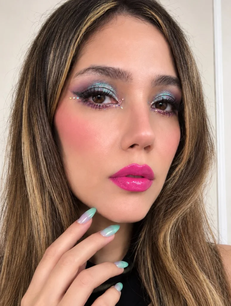 Electric pink lipstick in a vivid, saturated pink shade for bold statement lips.