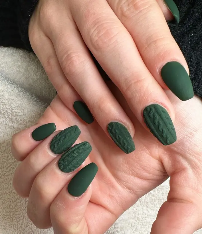 Emerald green Christmas sweater nails with raised cable-knit patterns and a soft matte finish