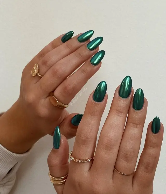 Emerald green chrome Christmas nails with a smooth, highly reflective metallic finish