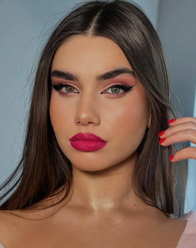 Fuchsia lipstick in a bright, cool magenta-pink shade for vibrant makeup.