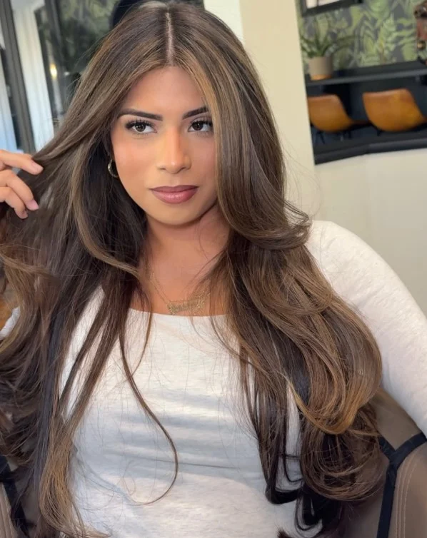 Golden brown hair color for light olive skin with subtle golden warmth and dimensional brunette tones.