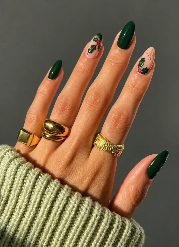 Green holly leaf Christmas nail art on a nude or cream base with fine gold details and small red berries