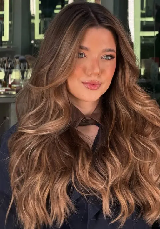 Honey bronze hair with warm golden-brown tones.