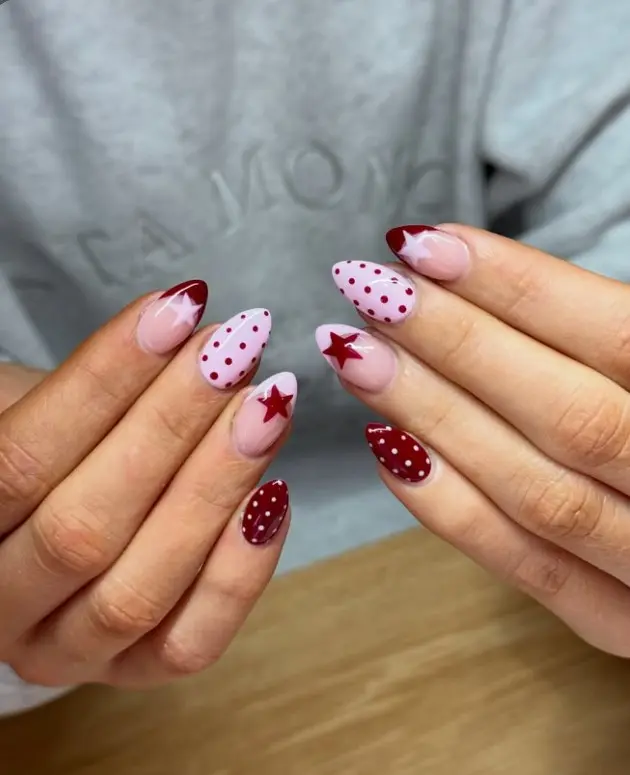Pink and red nail designs combining polka dots, French tips, and solid-color nails.