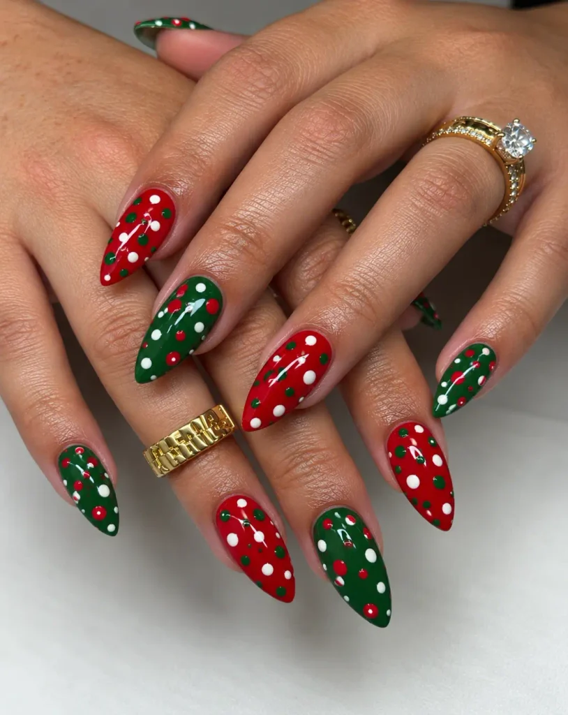 Red and green polka dot nails featuring mixed-size circles