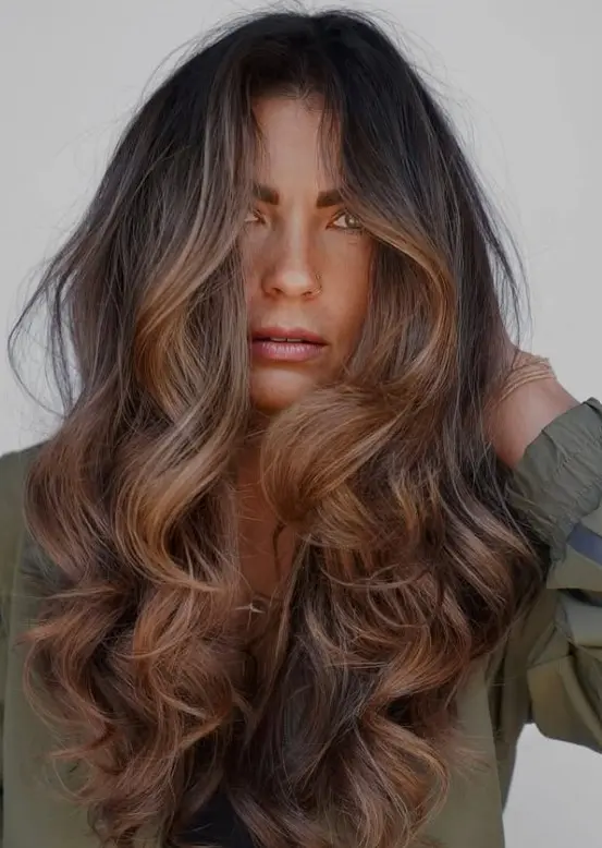 Mocha brown hair with soft, blended brunette highlights.