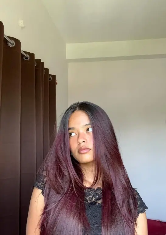 Plum cherry brown hair with deep purple and cool red undertones