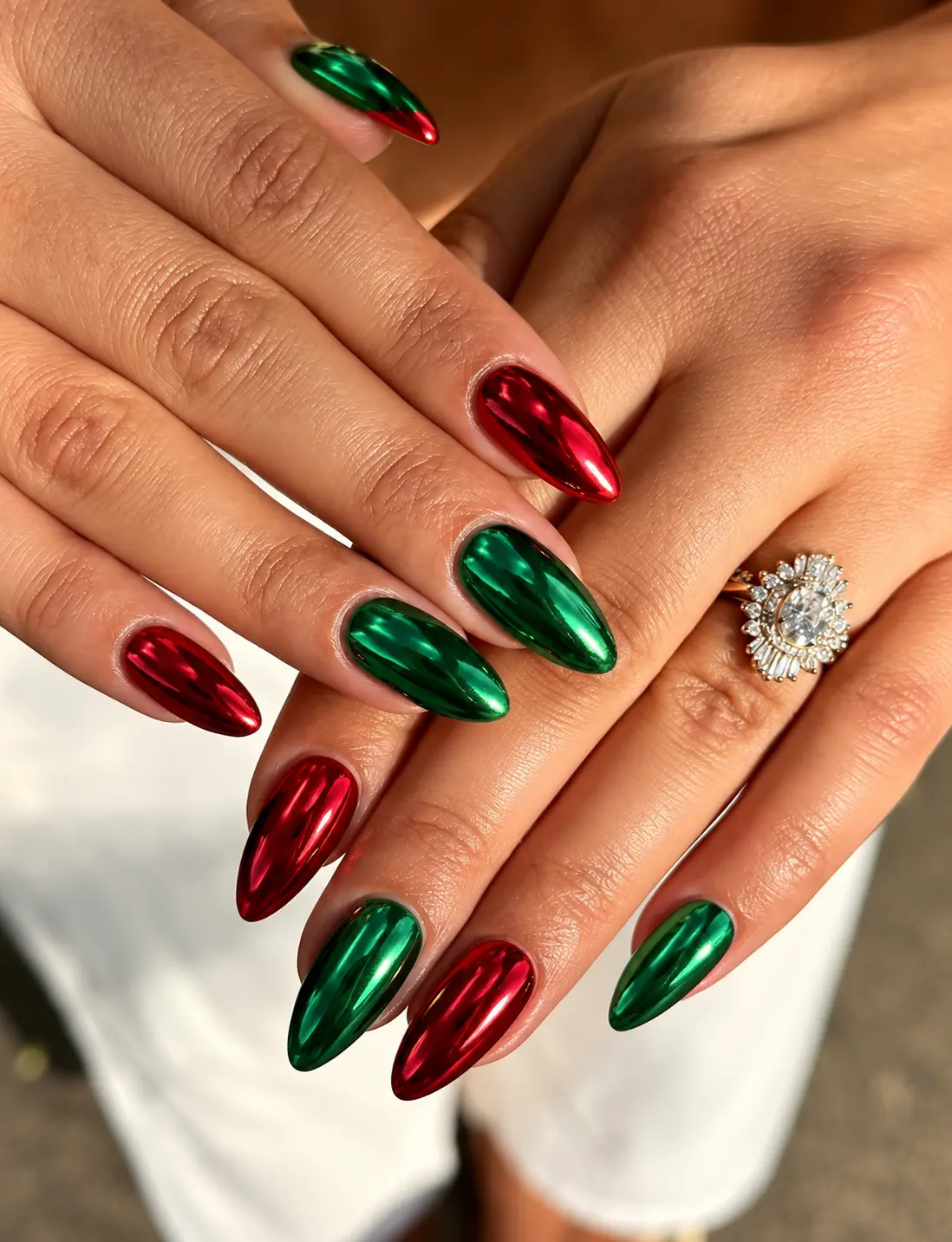 Red and green chrome Christmas nails with a smooth reflective metallic finish