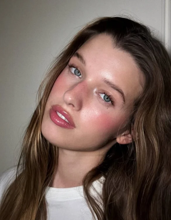 Rosewood lipstick featuring a muted blend of rosy pink and brown.
