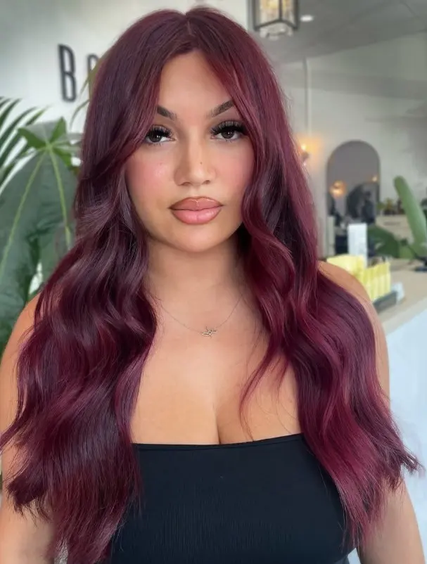 Ruby red-brown hair with a rich, noticeable cherry-red finish